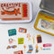 tin with matchbook print with tiger with CREATIVE SPARK! across the front with matchbook sticker flakes