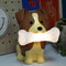 brown and tan dog with a bone in their mouth mood light