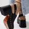 back view of model wearing black leather clogs with gold stud details at the sole