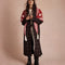 model wearing red triangle shawl with white folk floral print and white fringe