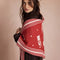 model wearing red triangle shawl with white folk floral print and white fringe