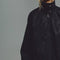 up close of model wearing black vegan suede relaxed fit jacket
