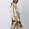 model wearing cream brown and tan oversized scarf with thick fringe on the end