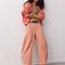 model wearing dessert pink barrel pants