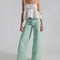 model wearing mint wide leg jeans