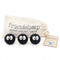 set of three black mini sprites with big white eyes