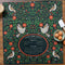 green tea towel with holiday sugar cookies with red floral and partridge print