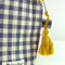 up close of navy and cream gingham quilted pouch with yellow print trim