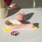 opened ceramic pink duck jewelry tray on a desk