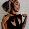 model wearing red ribbon bow hair clip