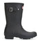side view of short black rubber rain boots with silver buckles on the side and hunter logo on the front
