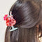 model wearing model wearing strawberry daiquiri drink hair claw