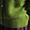 up close of model wearing artichoke green mohair cardigan
