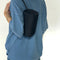 model wearing black nylon barrel handbag with leather buckle shoulder strap and trim