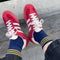 top view of model wearing navy crew socks with three gold stripes at the top