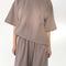 model wearing mushroom oversized tee with oversized sleeves