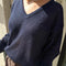 model wearing navy v-neck sweater