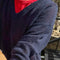 up close of model wearing navy v-neck sweater