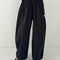 model wearing black parachute cotton pants