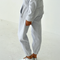 back view of model wearing light grey pointelle jogger pants