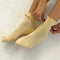 model wearing light yellow ruffle socks