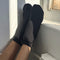 model wearing black ruffle socks