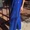 side view of model wearing cobalt blue corduroy arc pants