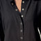up close of model wearing black snap front cotton cardigan