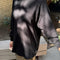 model wearing black cotton long sleeve tunic with mockneck