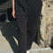 model wearing black cotton straight leg pants