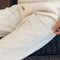 up close of model wearing naturel cotton straight leg pants