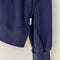 up close of navy pointelle sweatshirt with banded bottom