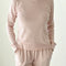model wearing light pink pointelle long sleeve tee