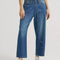 model wearing blue cropped button jeans with white bleach splatters