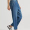 model wearing blue cropped button jeans with white bleach splatters
