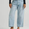 model wearing medium wash loose crop button fly jeans