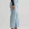 side view of model wearing medium wash loose crop button fly jeans