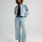 model wearing medium wash loose crop button fly jeans