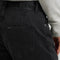 up close of model wearing black loose crop button fly jeans