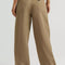 back view of model wearing tan brown slouch chino pants with pleated front