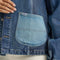 up close of light denim patch pocket