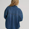 back view of model wearing dark denim relaxed shit button down shirt with patch pockets in the front