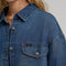 model wearing dark denim relaxed shit button down shirt with patch pockets in the front
