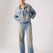 model wearing medium denim wash with tan wash on the legs with matching jacket