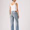 back view of model wearing medium denim wash with tan wash on the legs