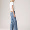 side view of model wearing light denim 90's ankle jeans