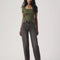 model wearing black wash relaxed straight leg jeans