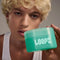 model holding 60 milky cleansing pads