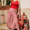 model wearing red and white gingham midi skirt