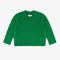 green textured v-neck sweater and twill skirt
